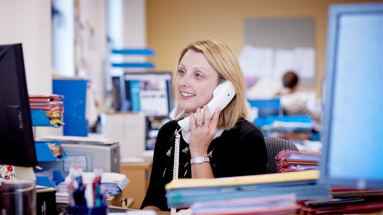 A member of Admissions staff giving advice on the telephone