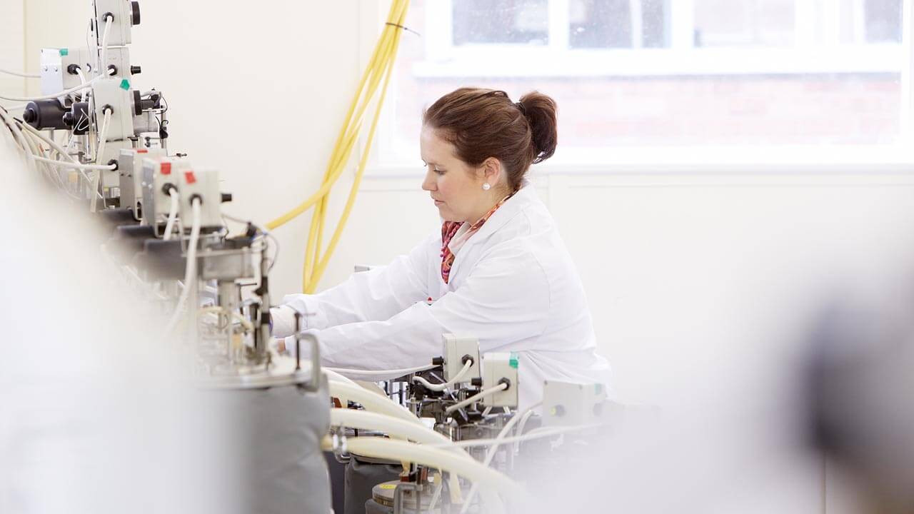 A research student in the labs
