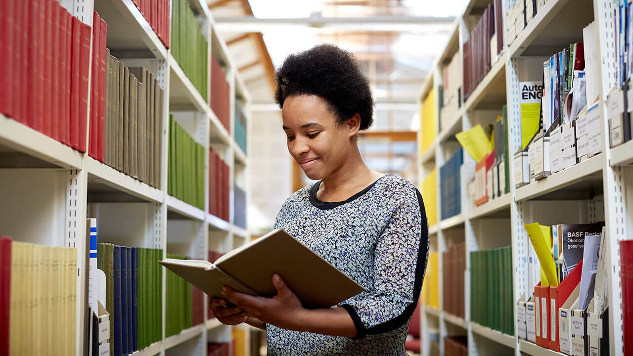 An undergraduate student in the library